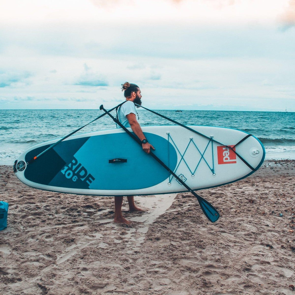 Esea strap sup leash and carry strap while carrying a sup